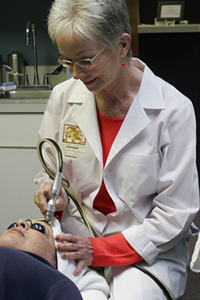 A skin care professional and her patient